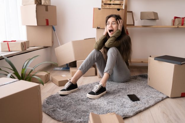 Stressed,Young,Woman,Surrounded,By,Large,Boxes,Cry,Scream,,No